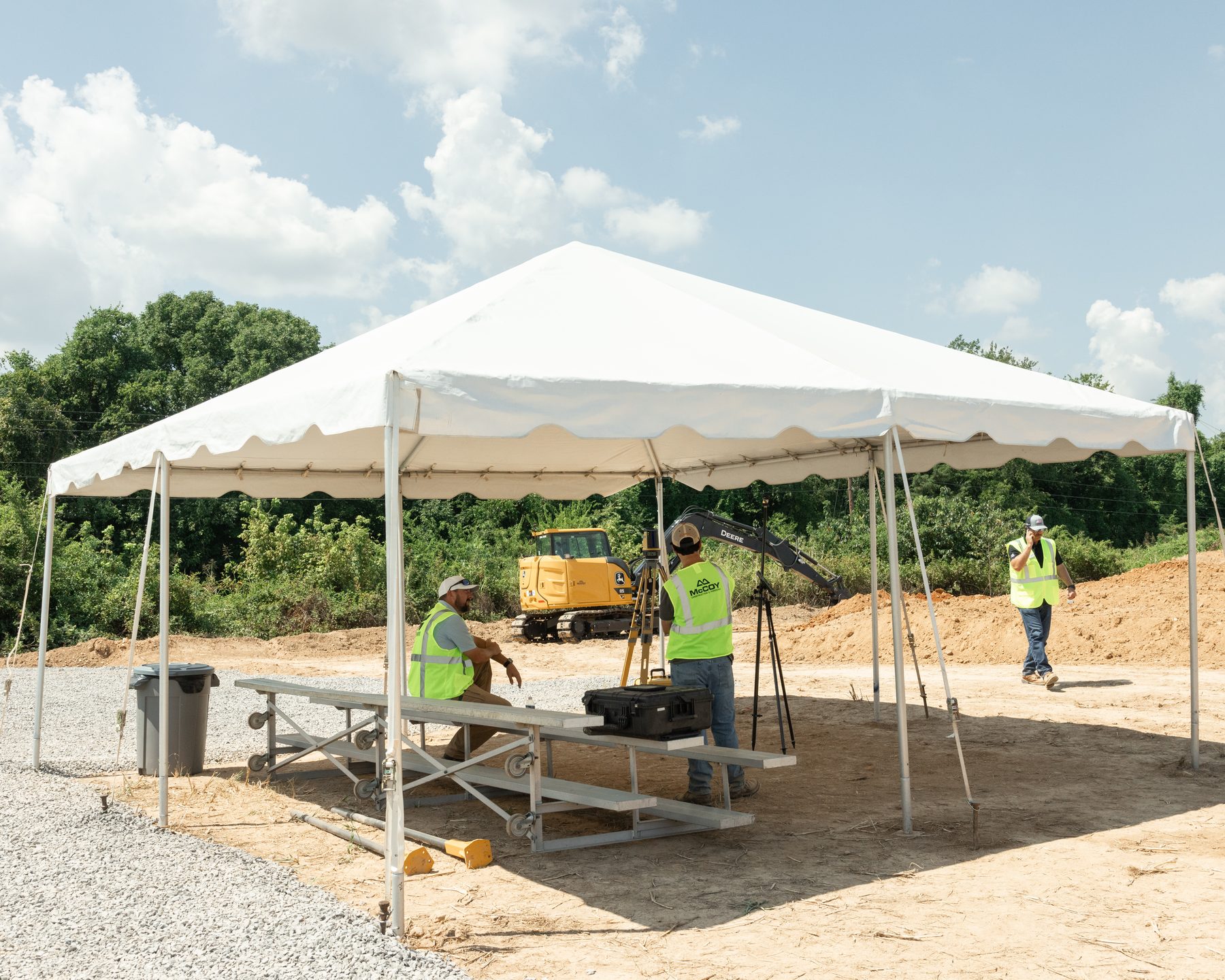 Tent and table setup for an outdoor corporate event