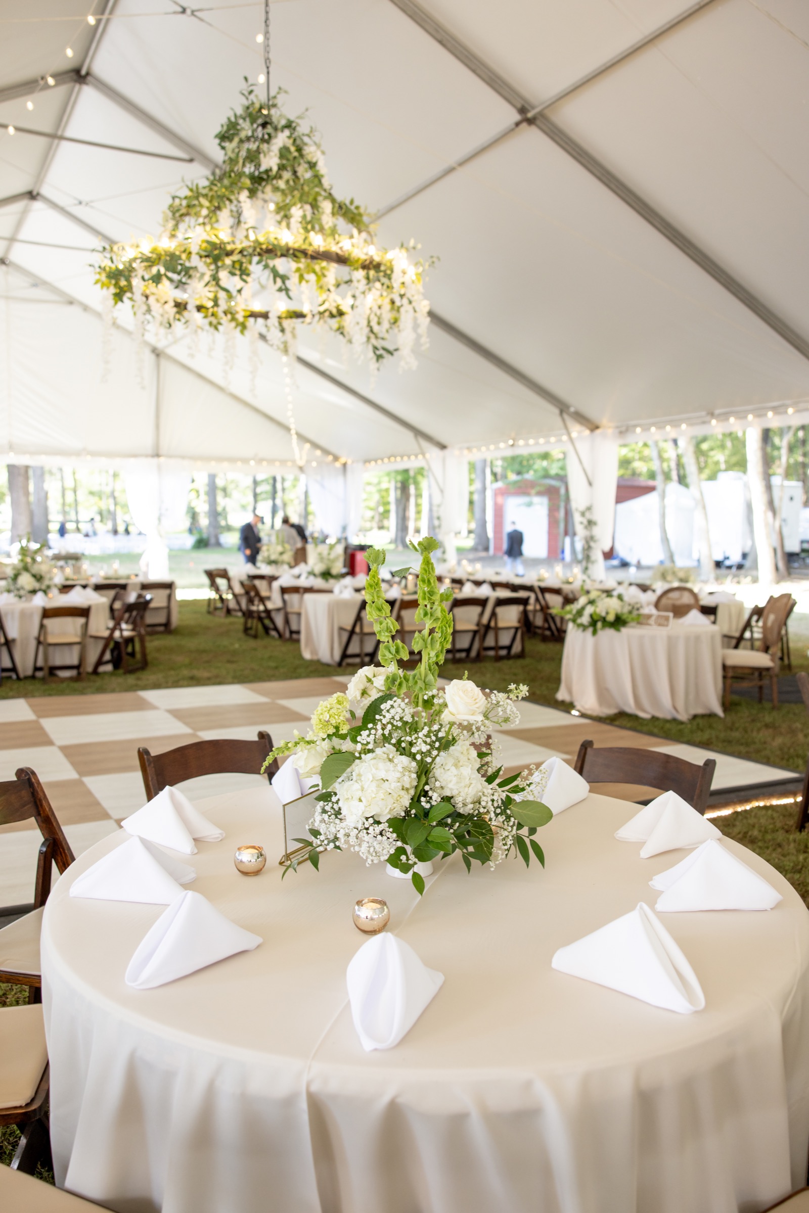 Wedding couple under a tent by PSR Events